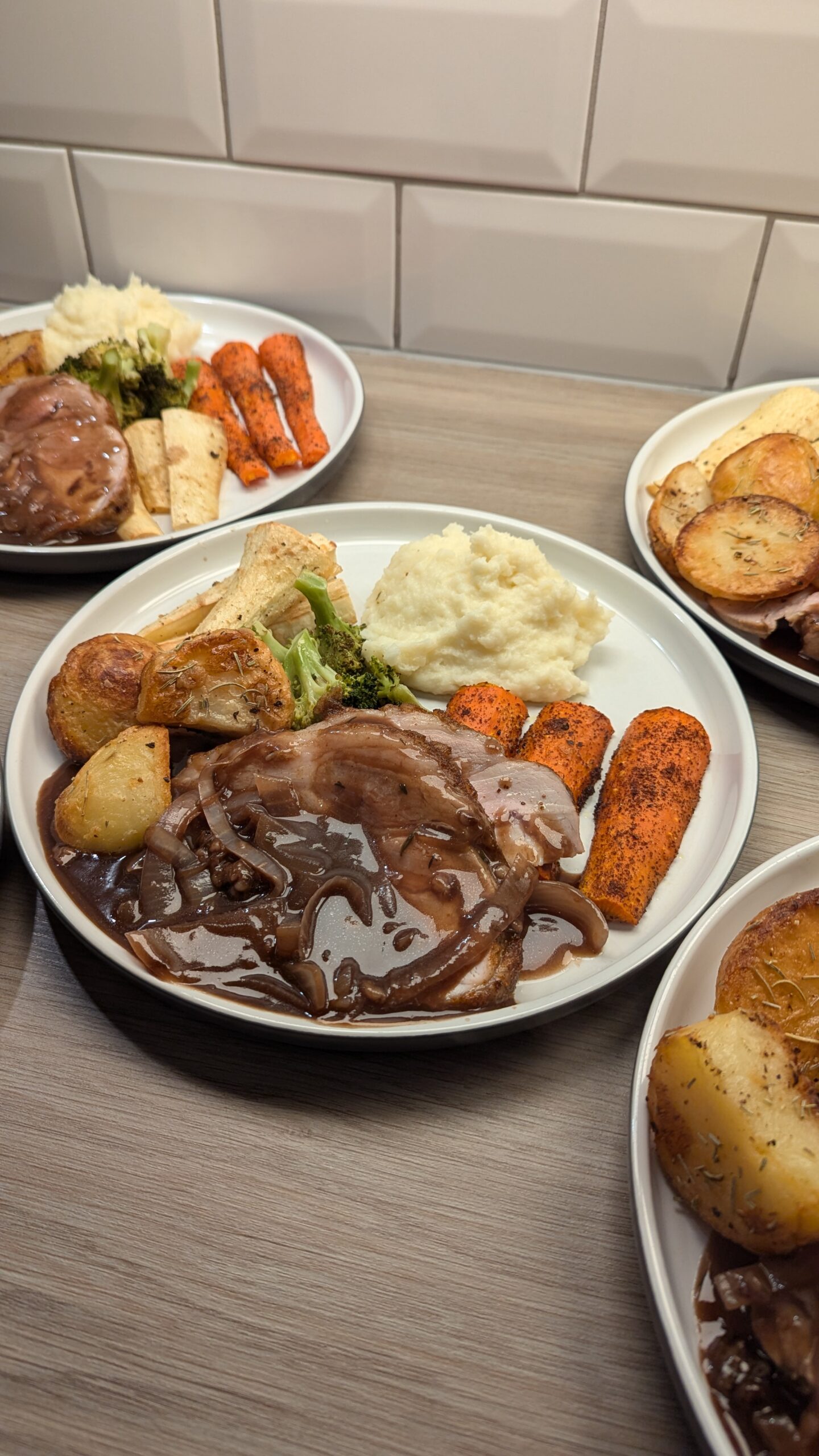 Roasted Harissa Pork Loin, Garlic and Rosemary Roast Potatoes, Sumac Carrots, Garlic Mash Potato, Parsnips and Broccoli with an Onion Gravy