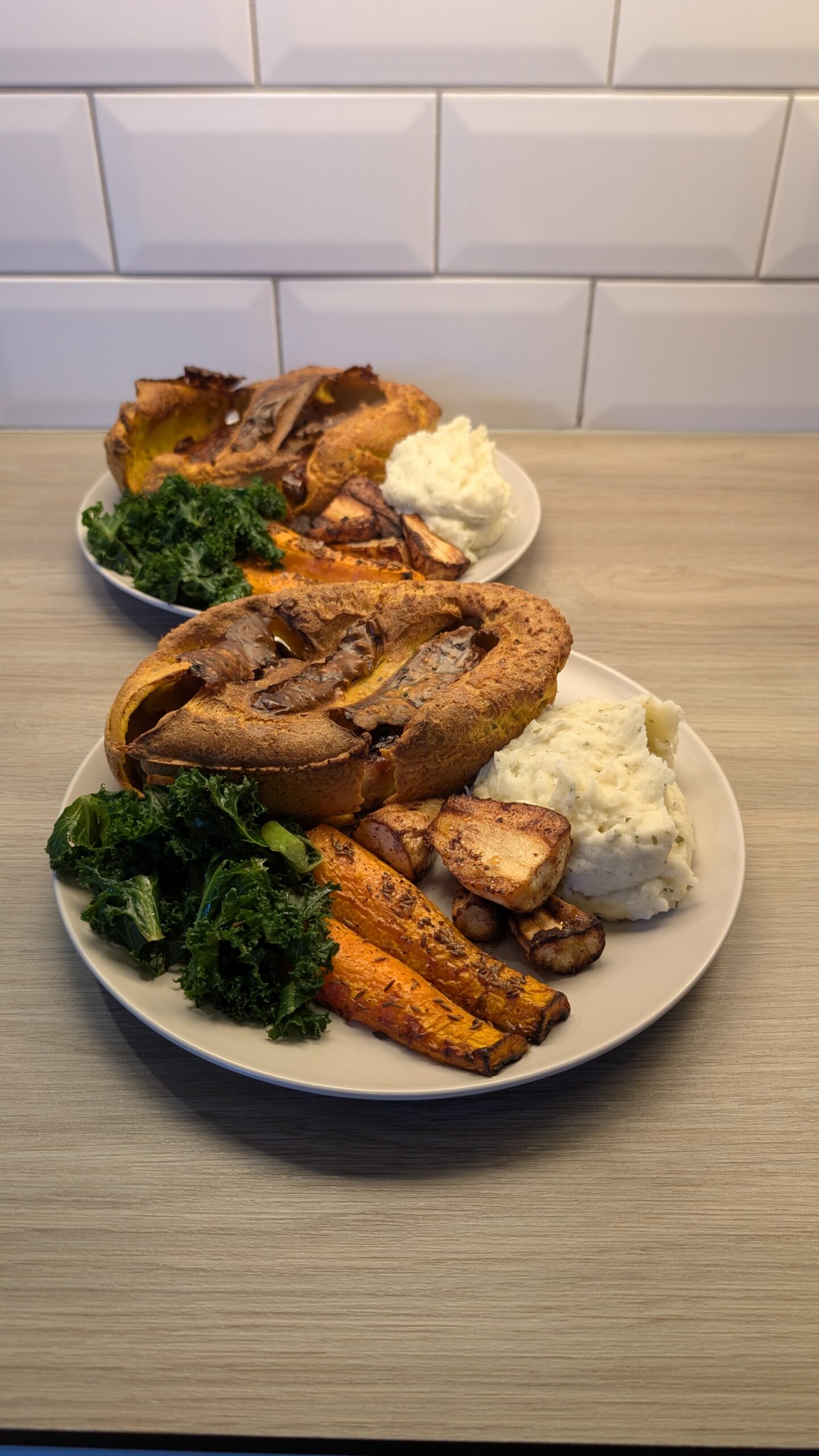 Indian Spiced Toad in the Hole, Garlic and Coriander Mash, Steamed Lemon and Mint Kale, Roasted Cinnamon and Honey Parsnips and Cumin Carrots with a Lightly Spiced Gravy