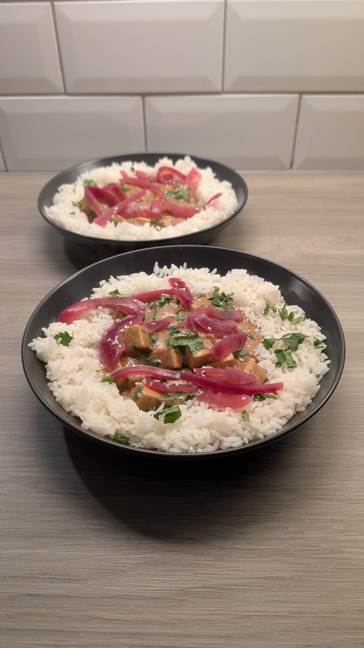 Tofu Peanut Curry and Fragrant Rice Topped with Pickled Red Onions