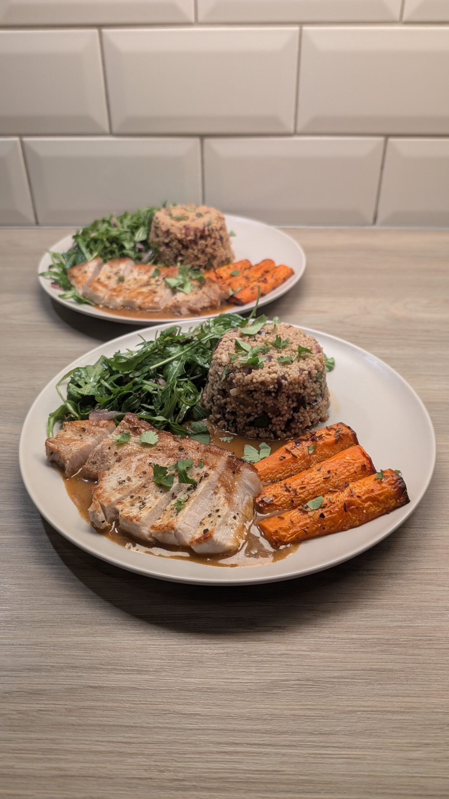 Pork Loin Steaks, Cous Cous, Chilli and Cumin Seed Roasted Carrots and a Honey Mustard Rocket Salad with a Smokey Pan Sauce