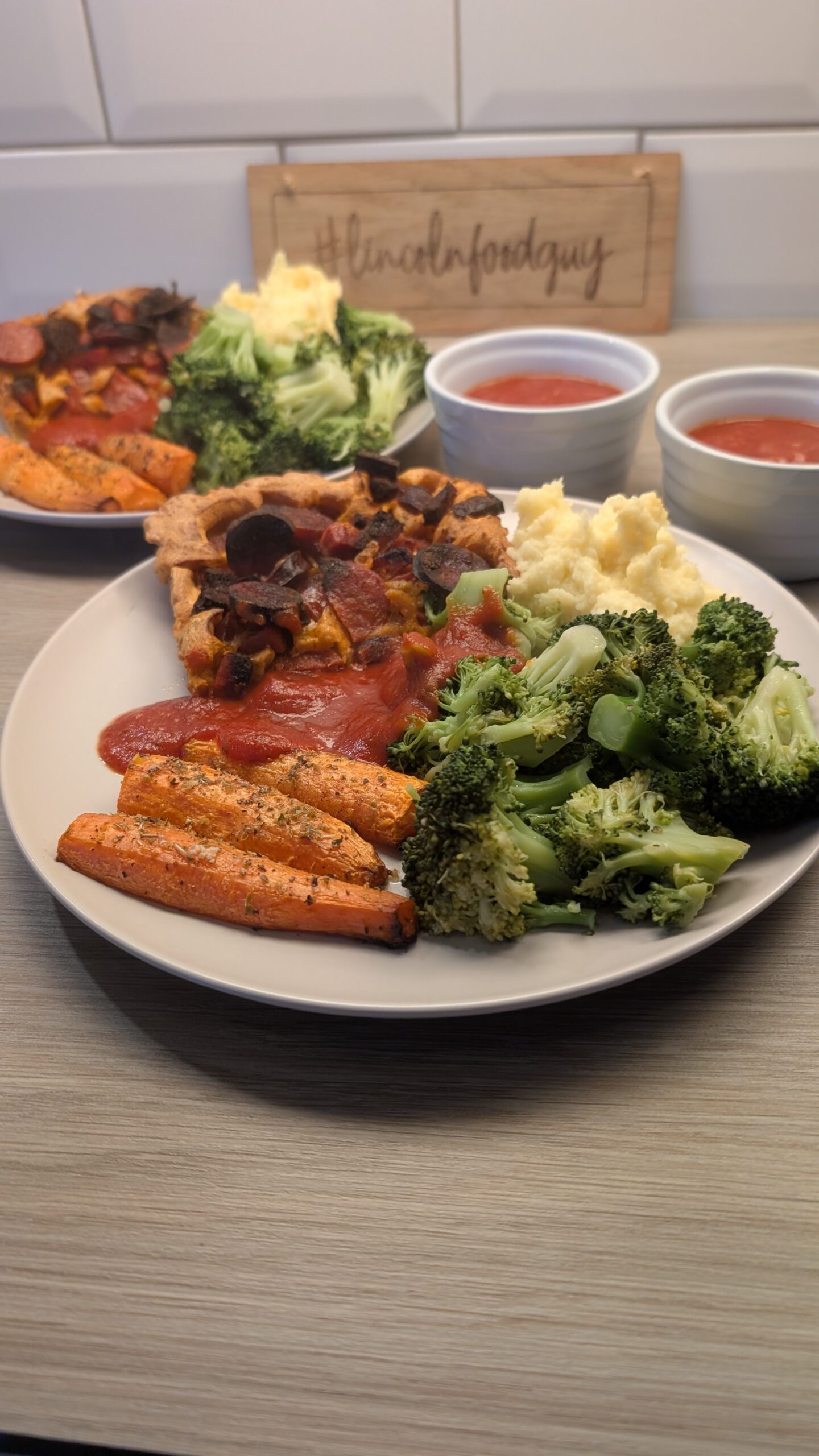 Chorizo Toad in the Hole, Garlic Mash Potato, Lemon Butter Broccoli and Roasted Carrots with a Balsamic Tomato Gravy