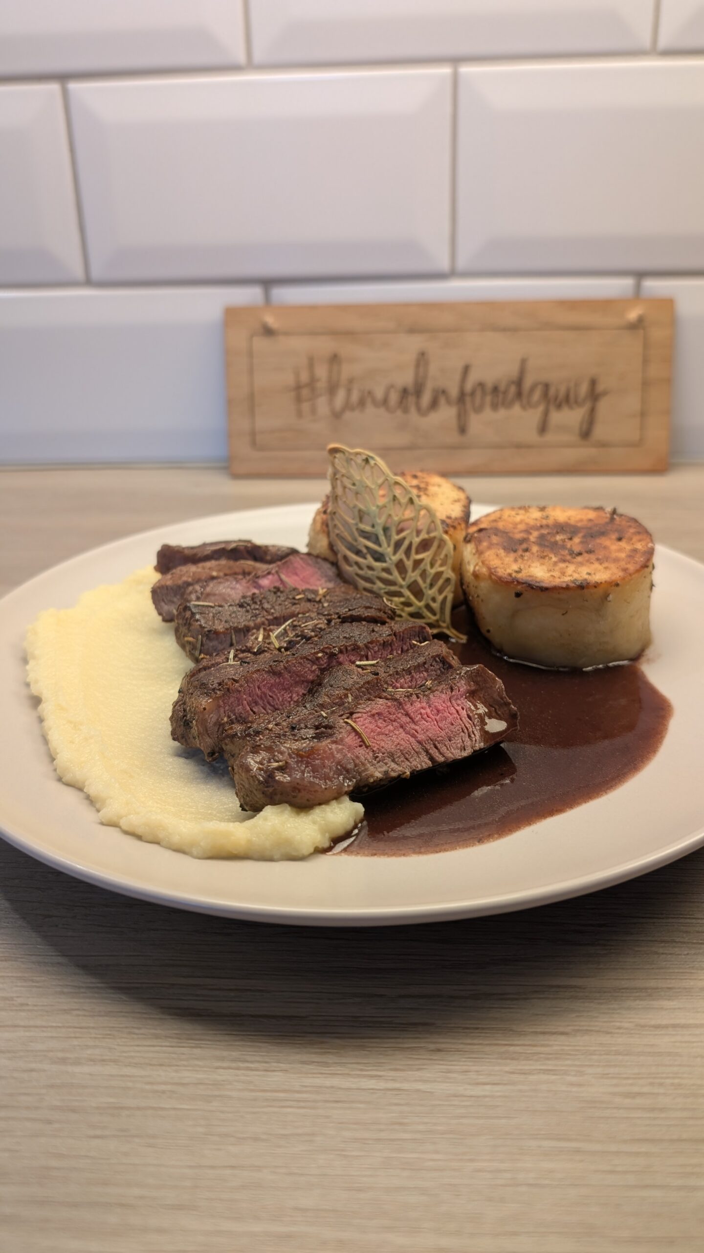 Fillet Steak, Fondant Potatoes, Parsnip Puree and a Parsley Tuile with a Red Wine Reduction