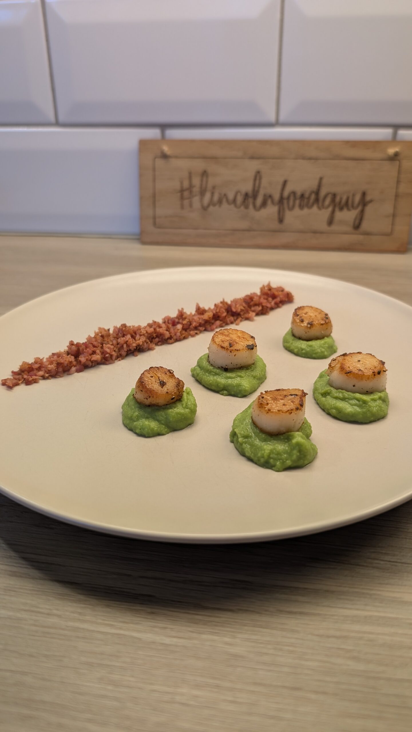 Scallops on a Pea Puree with a Bacon Crumb