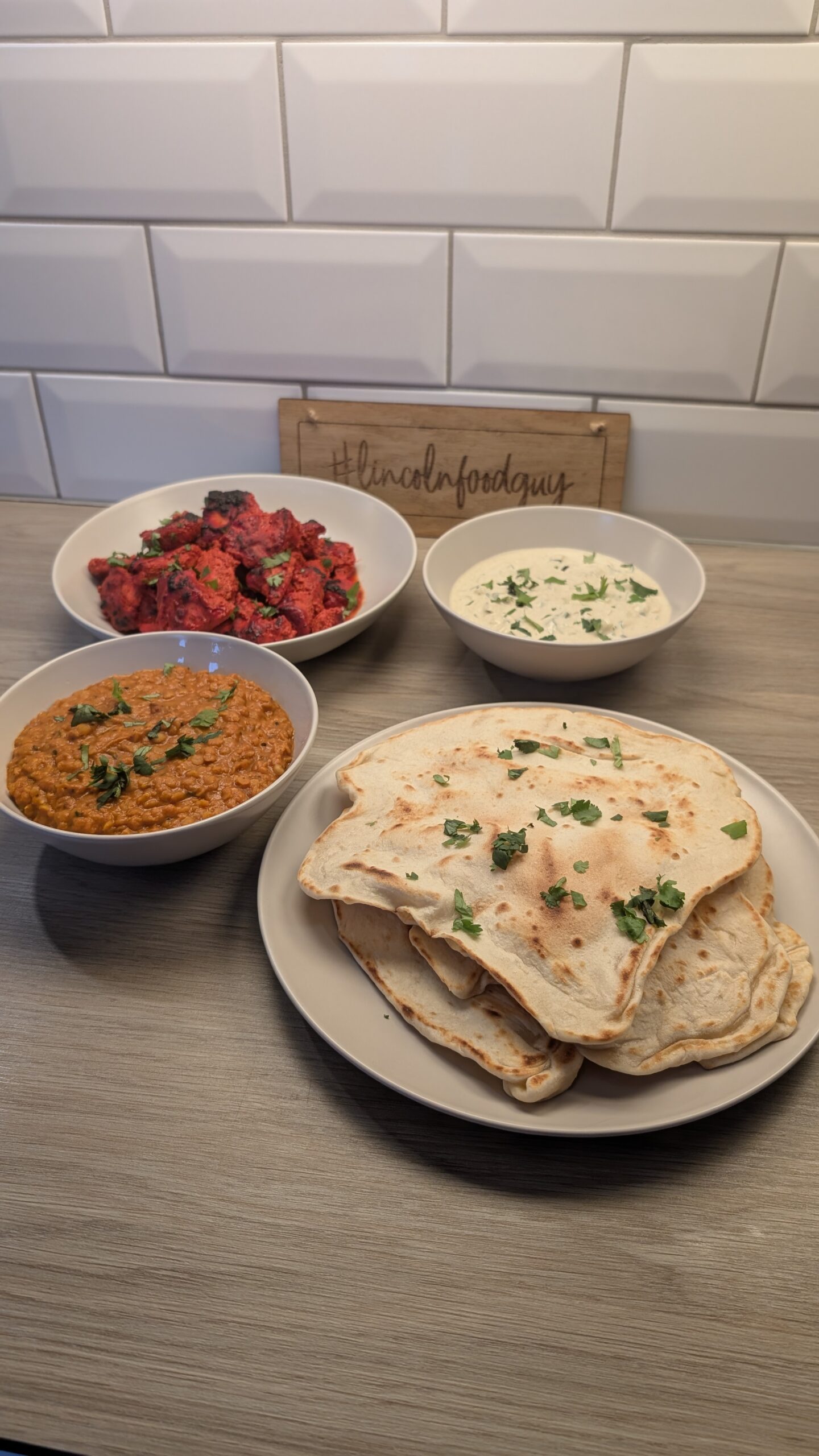 Tandoori Chicken, Masoor Dal, Raita and Flat Breads